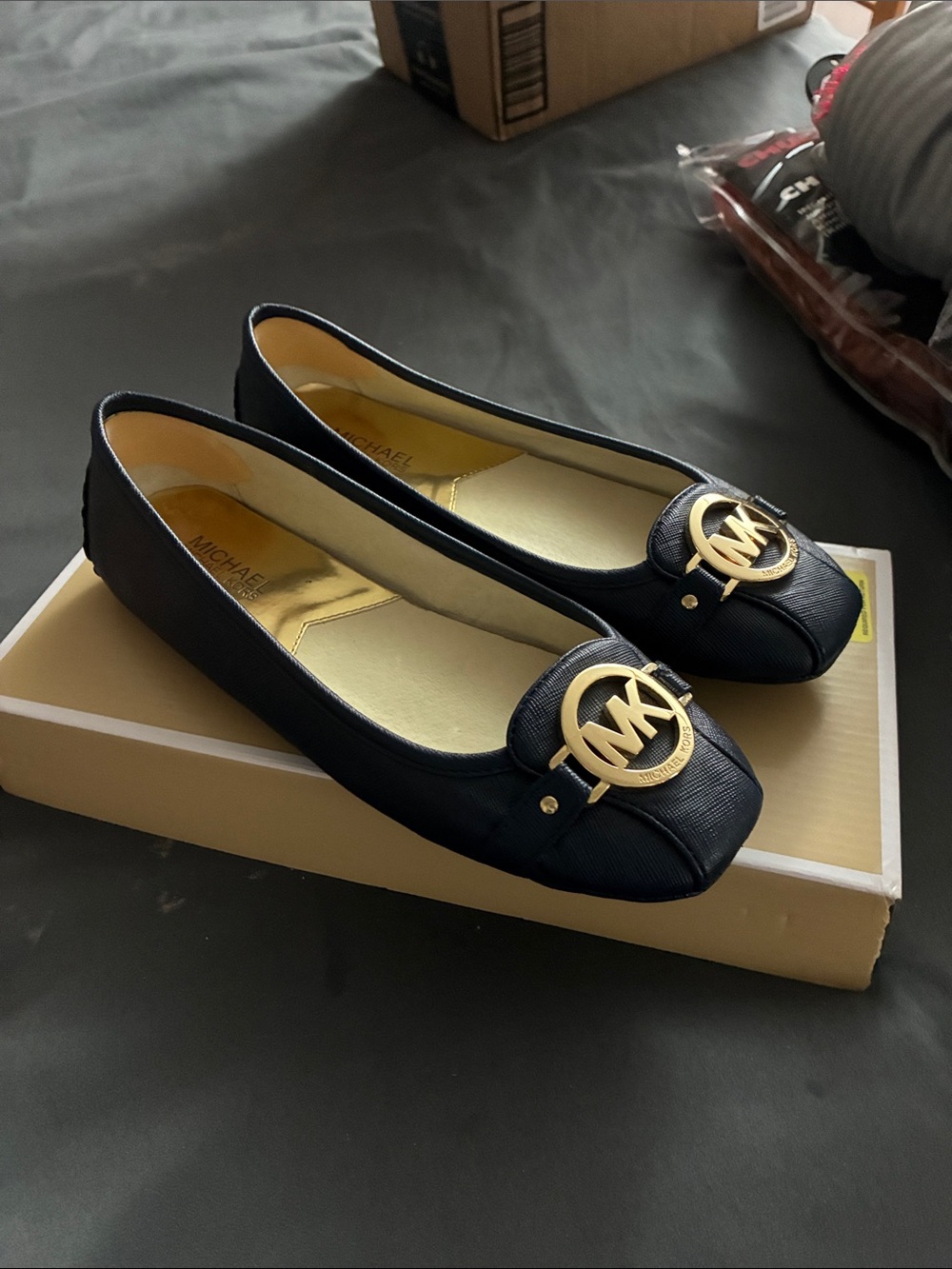MICHAEL Michael Kors Black Ballet Flats with Gold MK Medallion